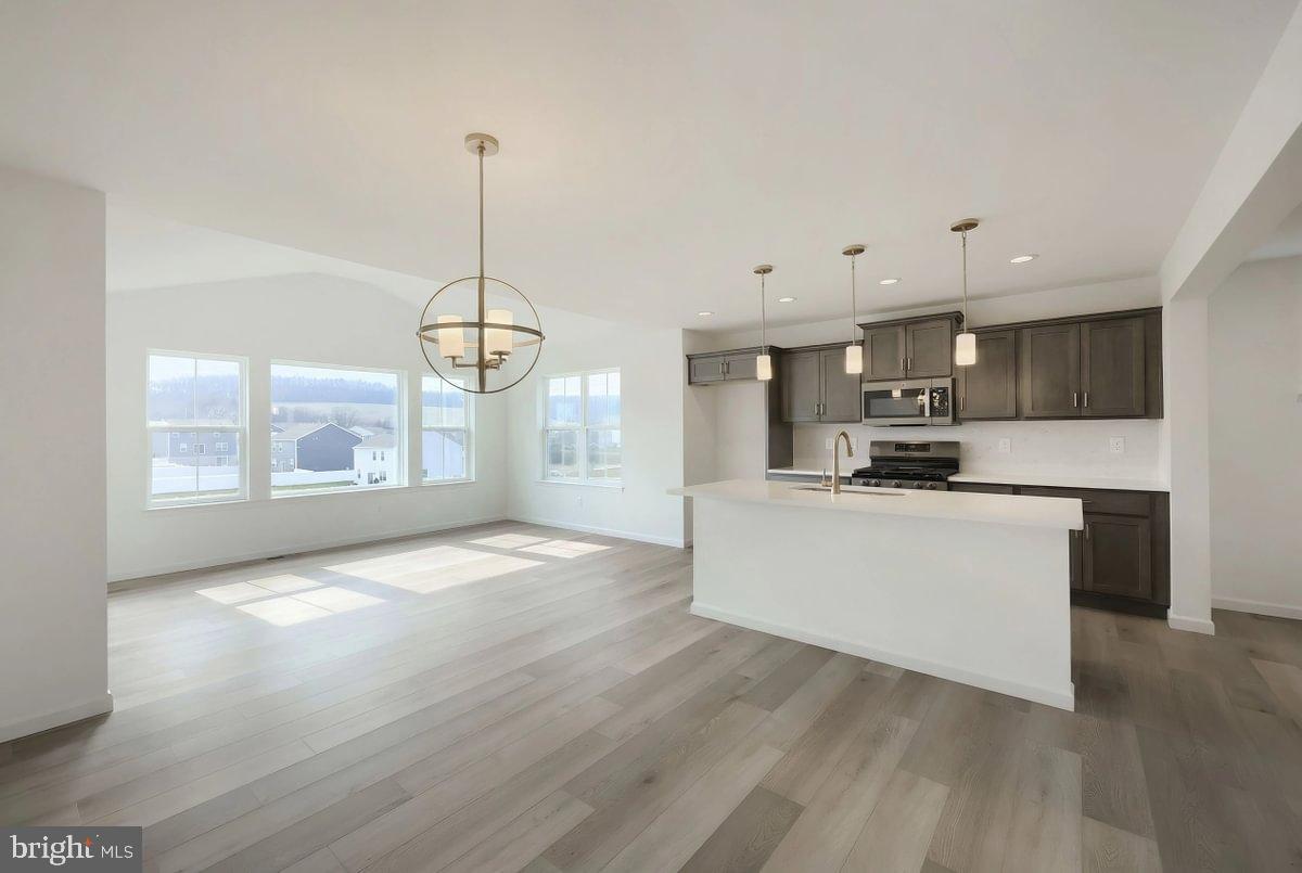 6324 Liam Drive Spring Grove, PA 17362 - Photo 16 of 38 a view of kitchen with kitchen island wooden floor and window