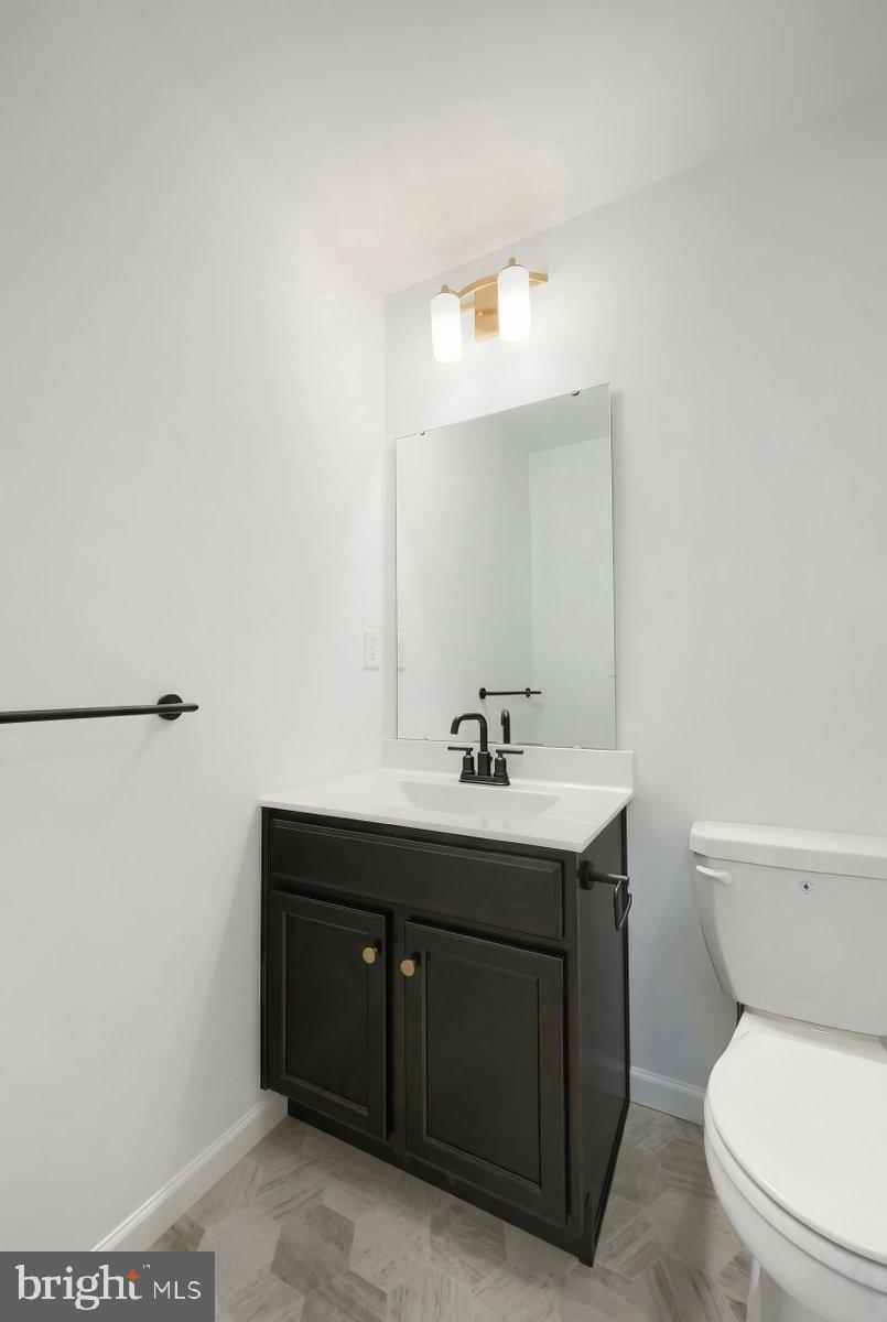 6324 Liam Drive Spring Grove, PA 17362 - Photo 19 of 38 a bathroom with a toilet a sink and mirror