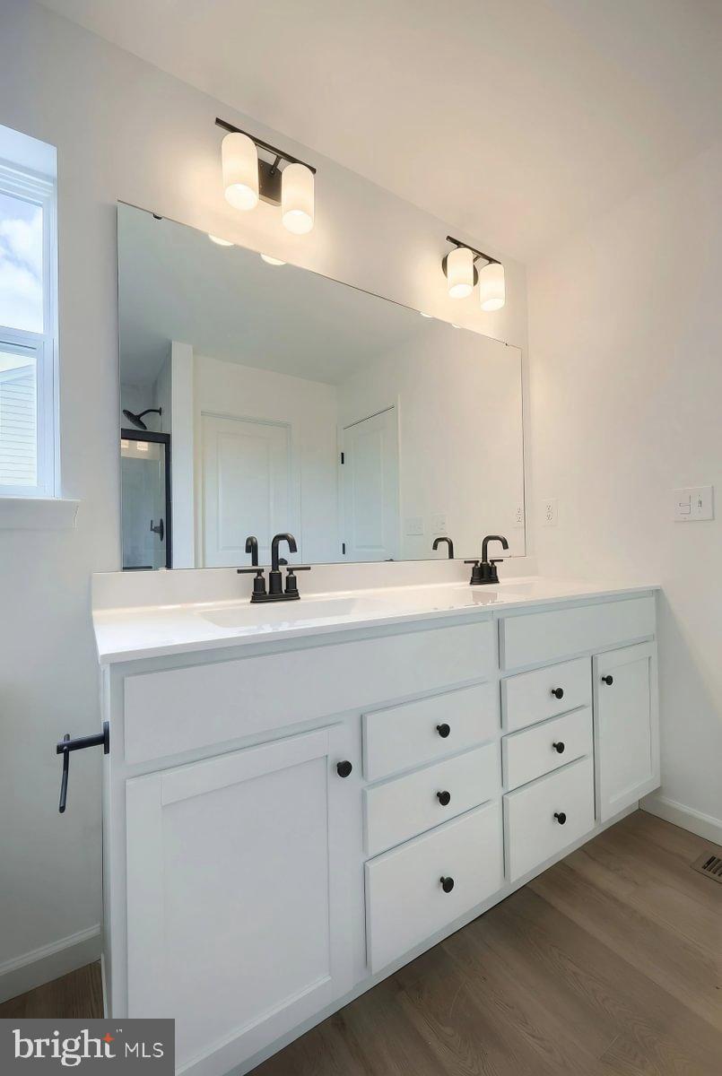6324 Liam Drive Spring Grove, PA 17362 - Photo 27 of 38 a bathroom with a double vanity sink and mirror