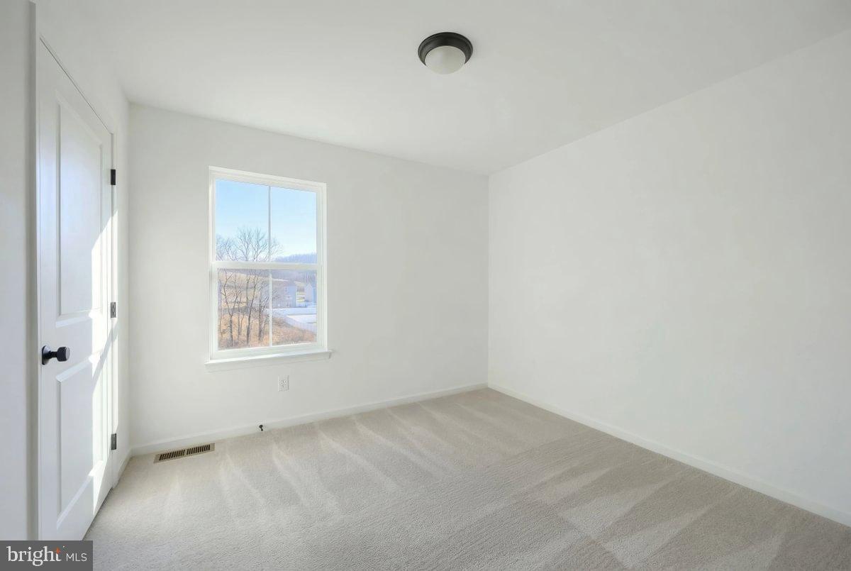 6324 Liam Drive Spring Grove, PA 17362 - Photo 31 of 38 an empty room with windows