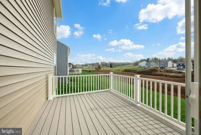 a view of a balcony with wooden floor