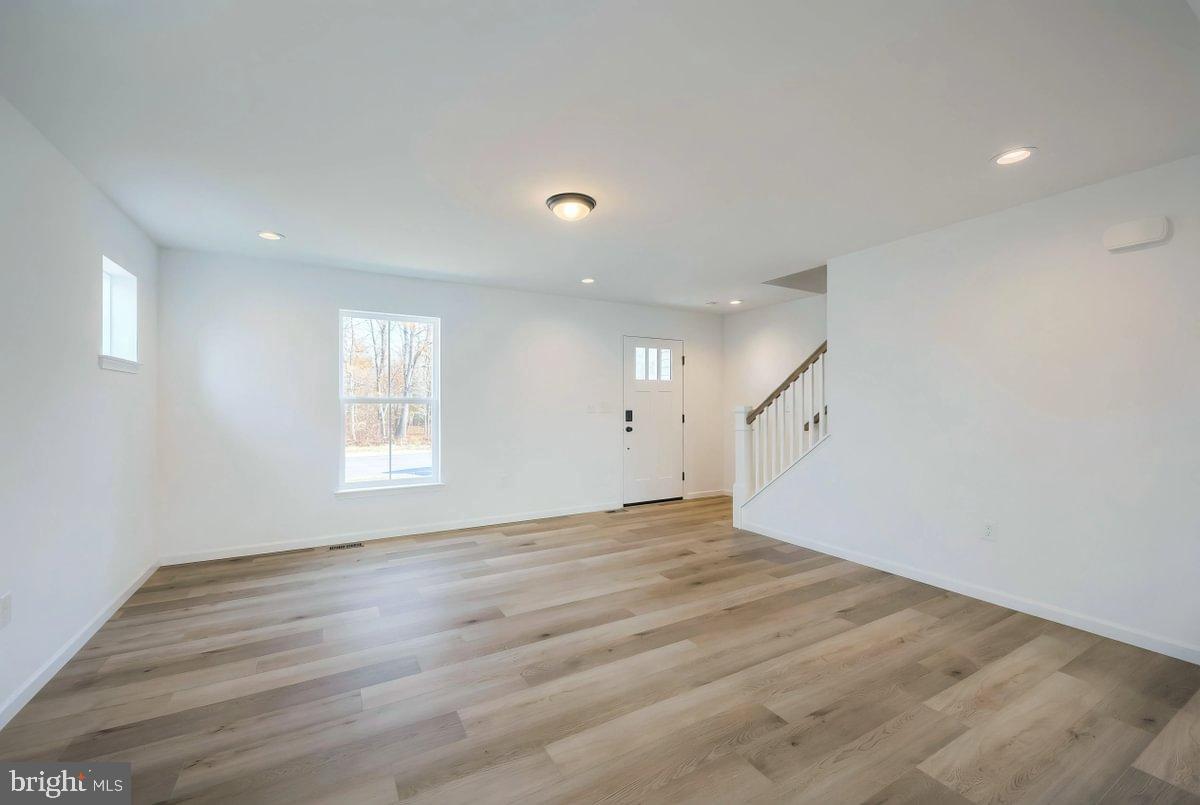 6324 Liam Drive Spring Grove, PA 17362 - Photo 8 of 38 wooden floor in an empty room with a window