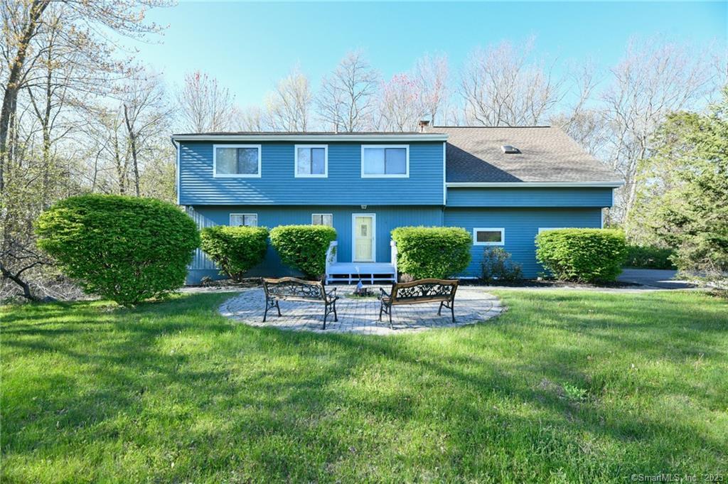 32 Brighton Road Prospect, CT 06712 - Photo 1 of 1 a view of house with backyard and outdoor seating