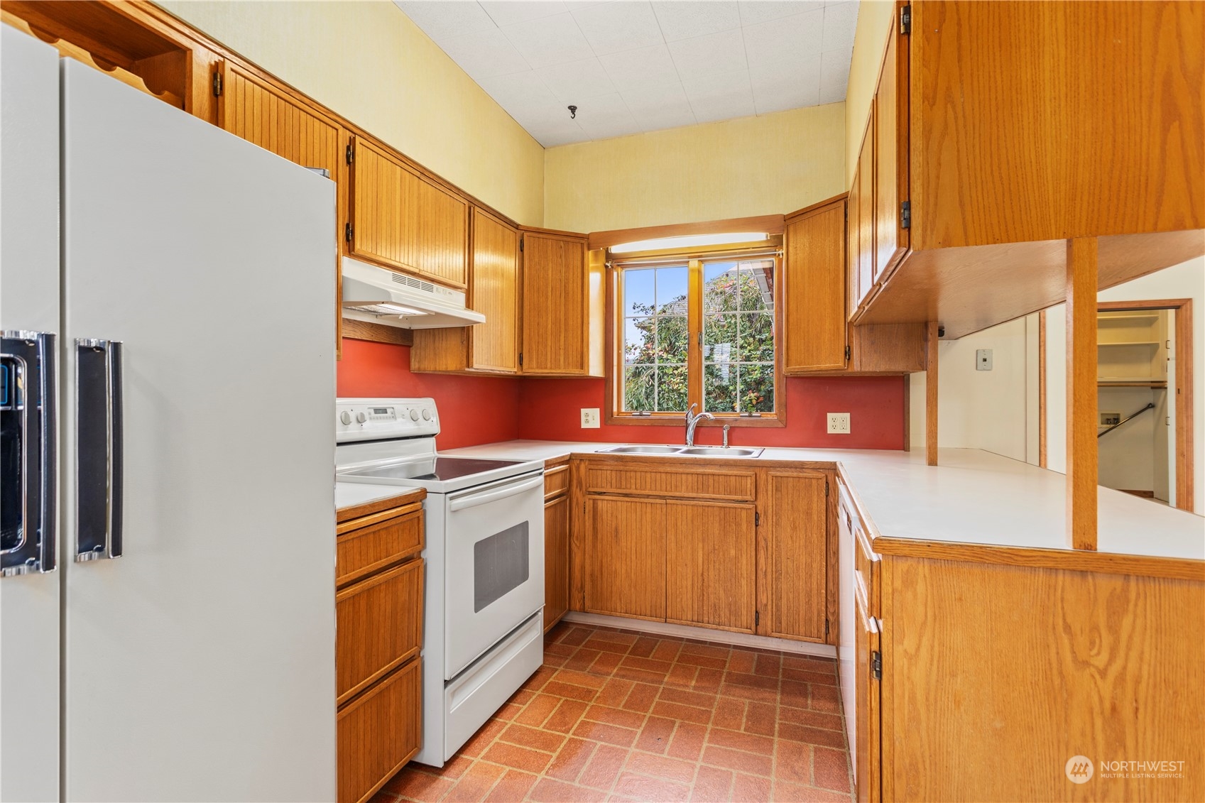 1809 Harris Avenue Bellingham, WA 98225 - Photo 11 of 27 a kitchen with stainless steel appliances granite countertop a sink and a refrigerator