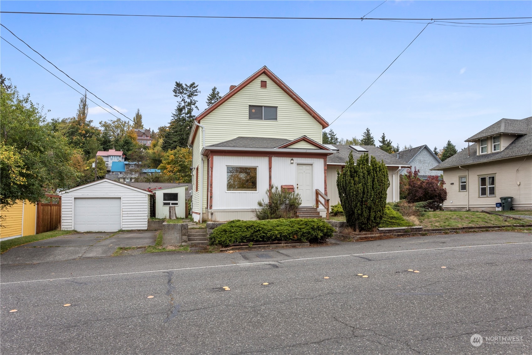 1809 Harris Avenue Bellingham, WA 98225 - Photo 2 of 27 a front view of a house with a yard and garage