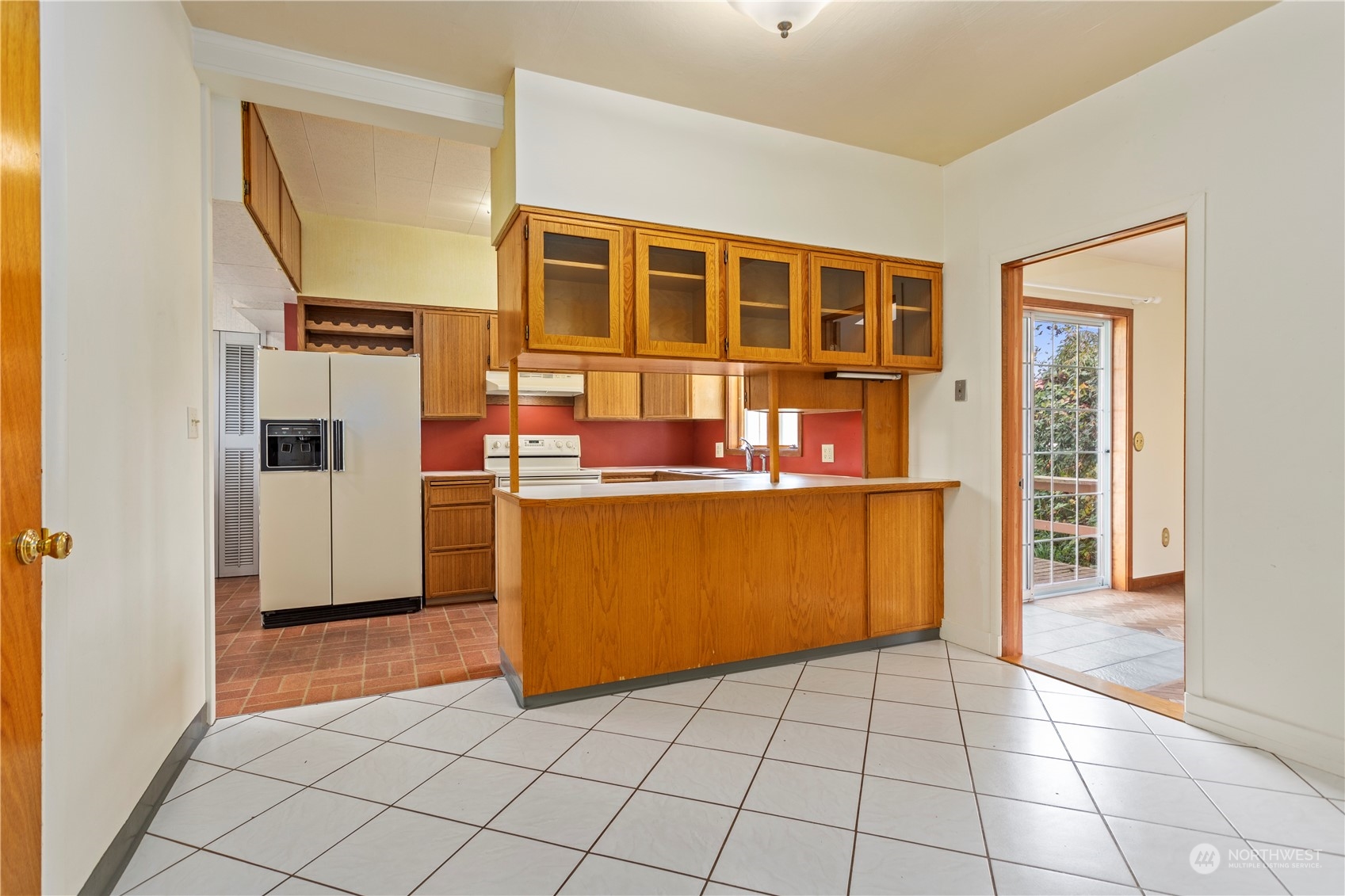 1809 Harris Avenue Bellingham, WA 98225 - Photo 9 of 27 a kitchen with stainless steel appliances granite countertop a refrigerator and a stove