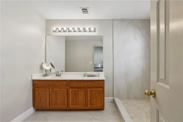 a bathroom with a sink and a mirror