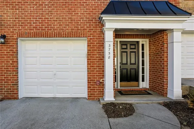 a front view of a house with a gate