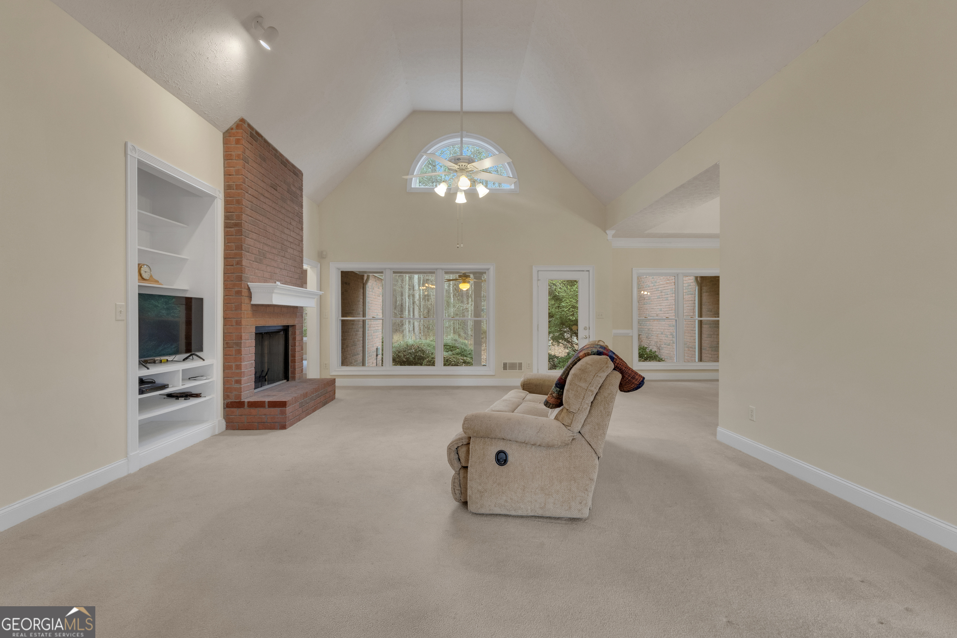 155 Rising Star Road Fayetteville, GA 30215 - Photo 11 of 89 a living room with furniture and a fireplace