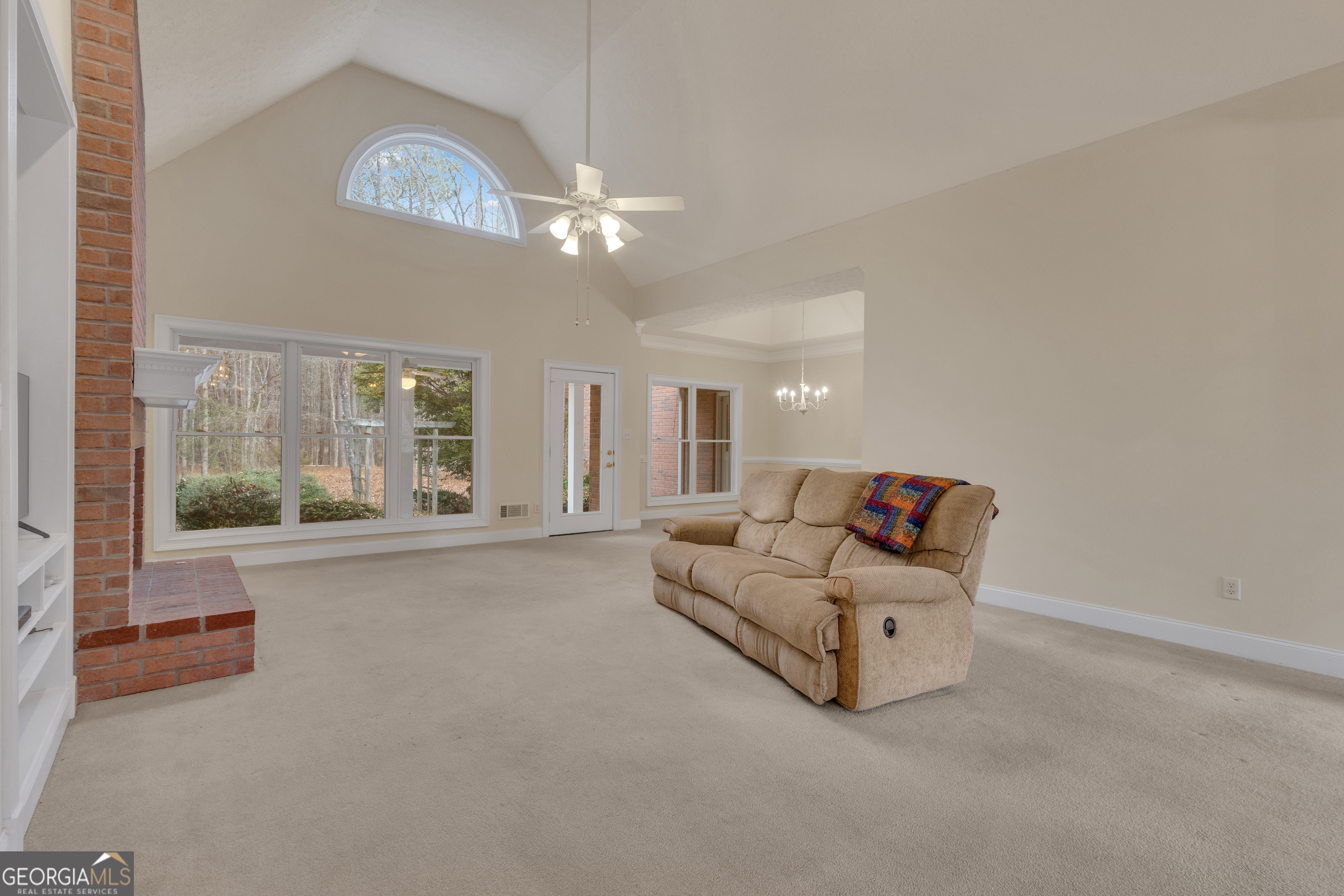 155 Rising Star Road Fayetteville, GA 30215 - Photo 14 of 89 a living room with furniture and a chandelier
