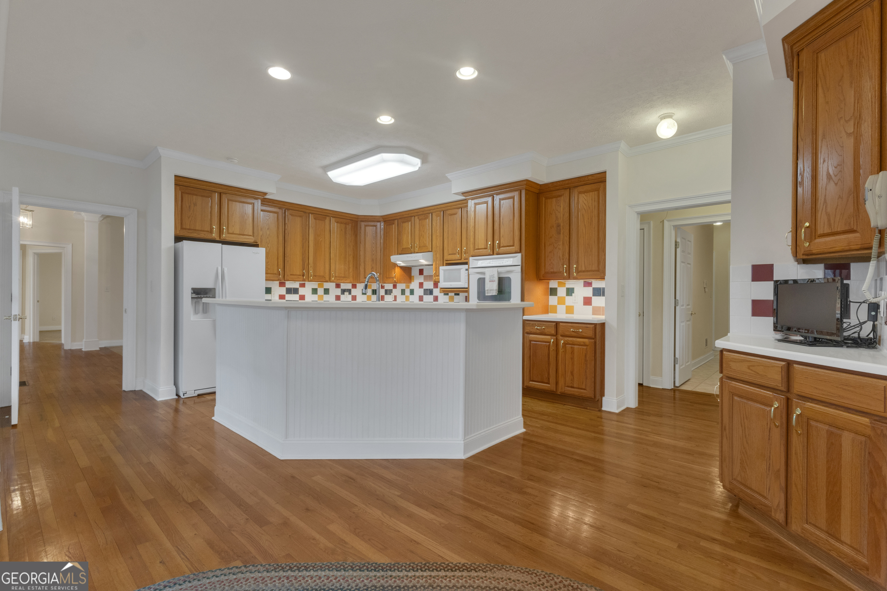 155 Rising Star Road Fayetteville, GA 30215 - Photo 18 of 89 a kitchen with stainless steel appliances a refrigerator and a stove top oven