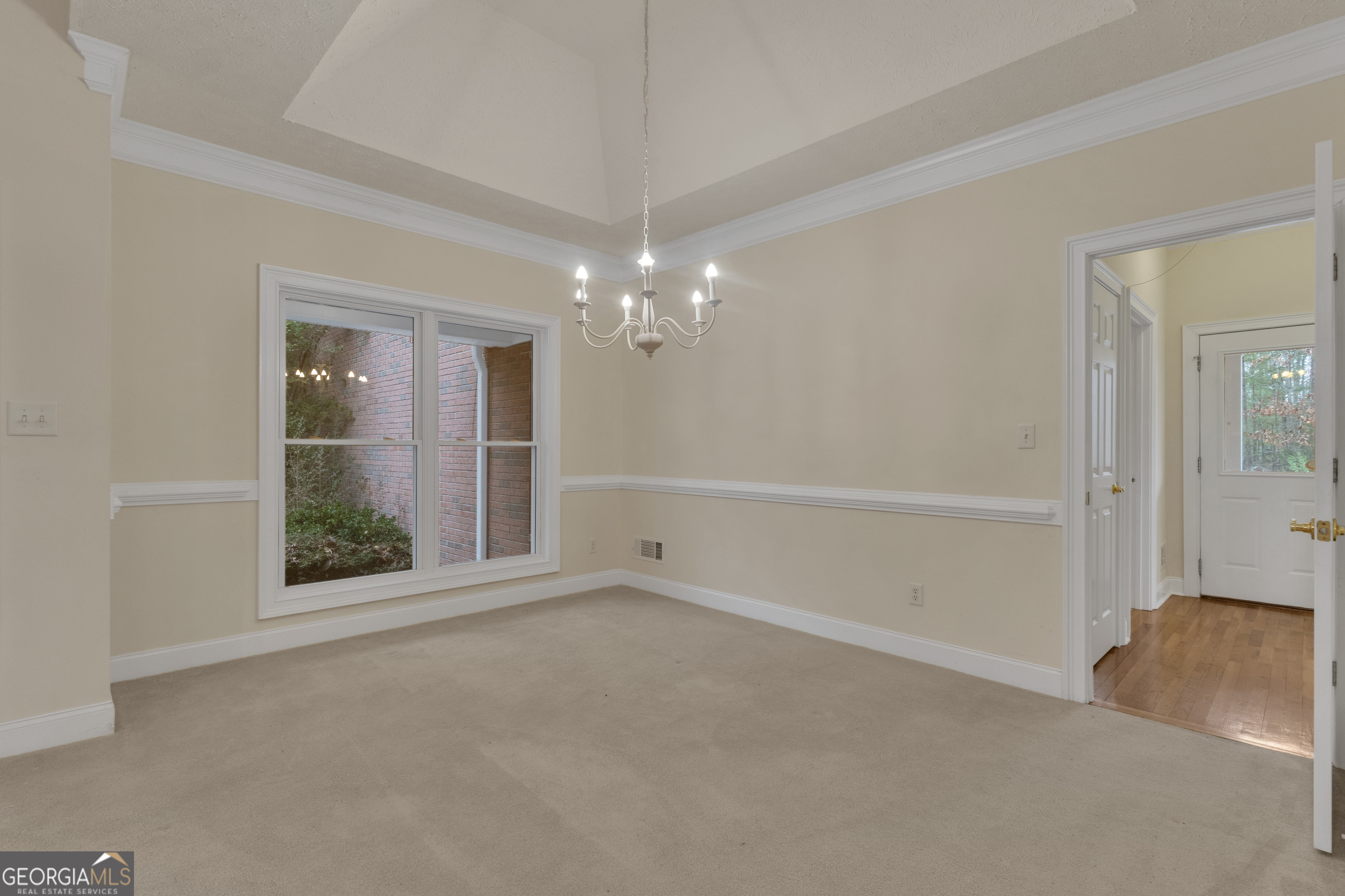155 Rising Star Road Fayetteville, GA 30215 - Photo 20 of 89 a view of an empty room with window and chandelier fan