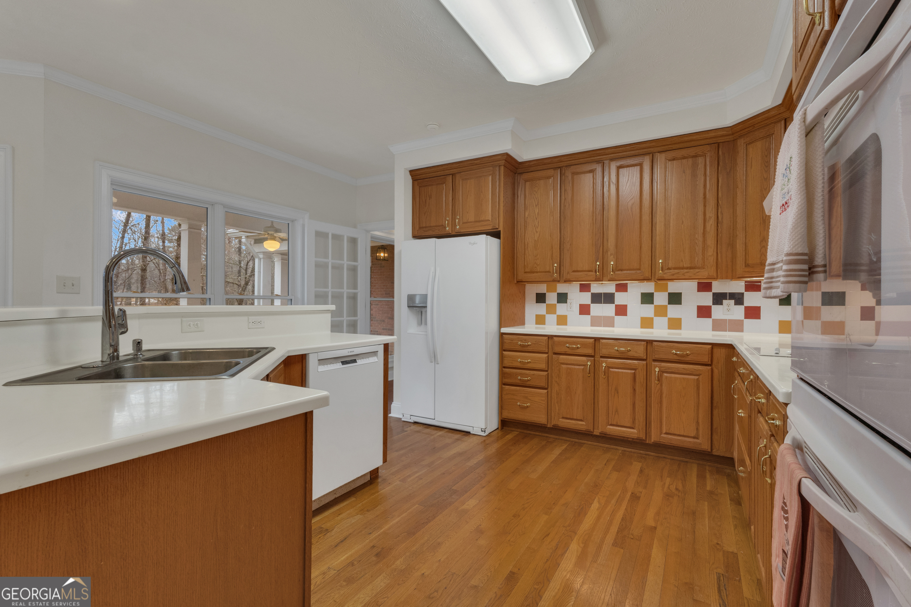 155 Rising Star Road Fayetteville, GA 30215 - Photo 25 of 89 a kitchen with granite countertop a sink stove and refrigerator