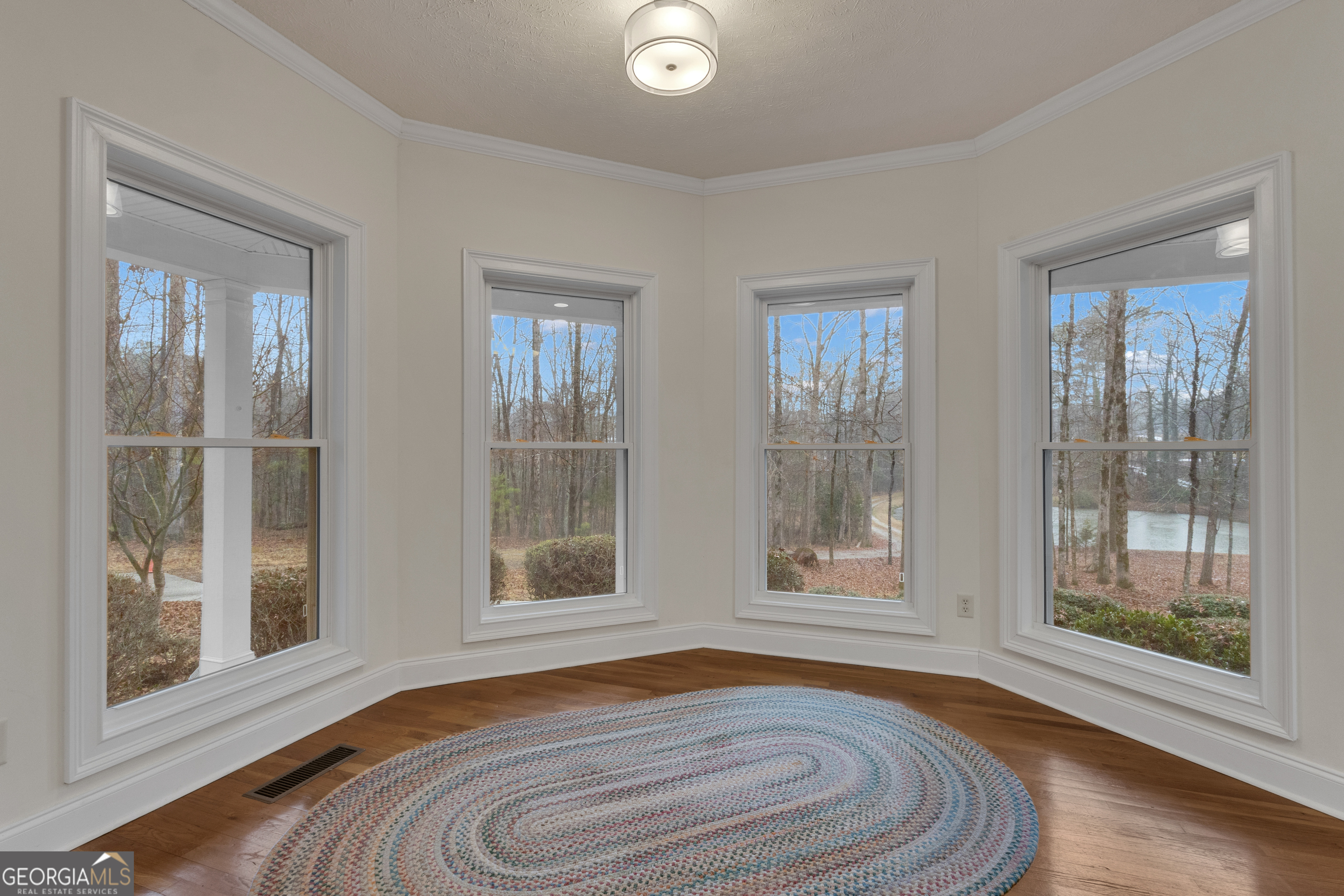 155 Rising Star Road Fayetteville, GA 30215 - Photo 30 of 89 a view of empty room with wooden floor and fan