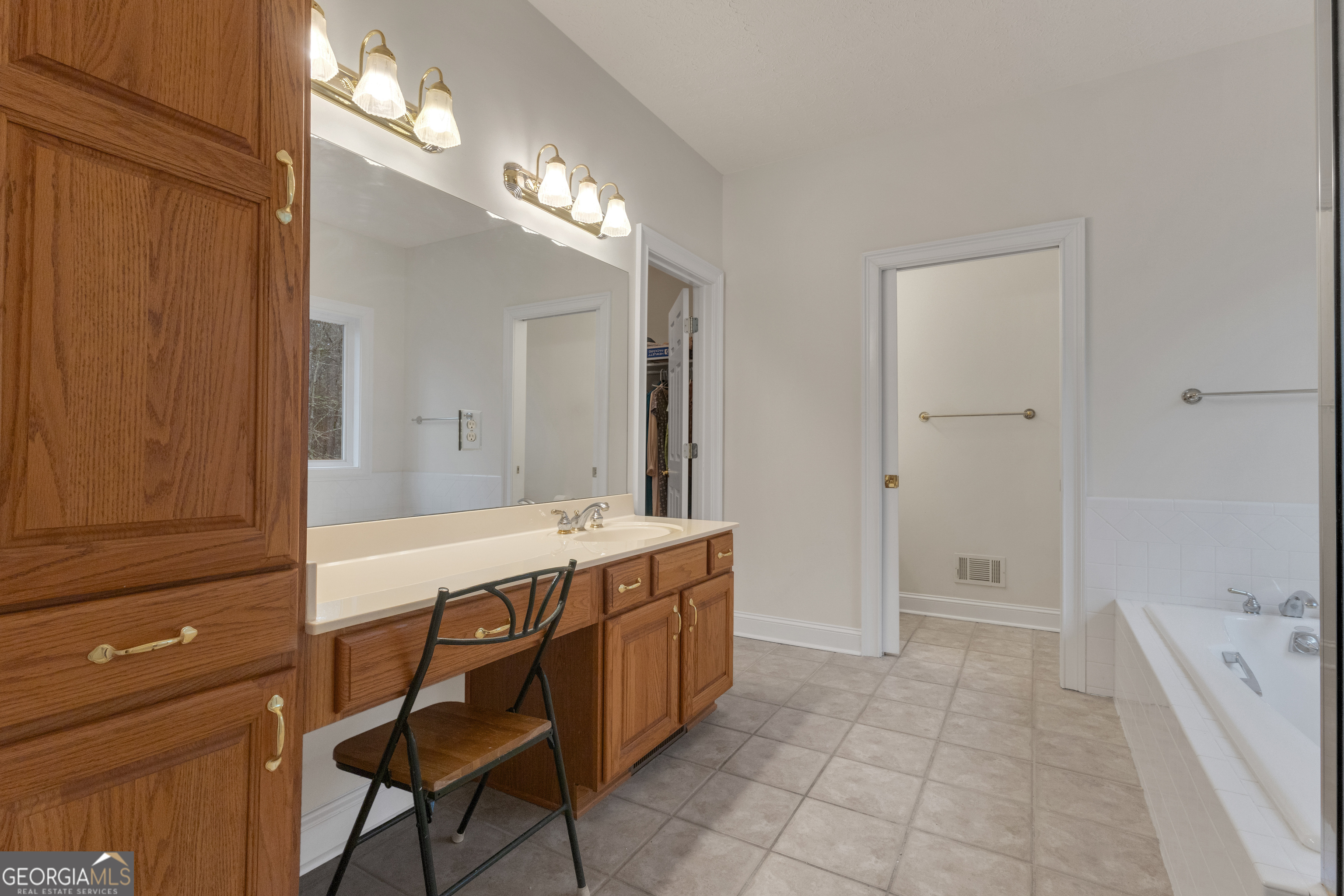 155 Rising Star Road Fayetteville, GA 30215 - Photo 37 of 89 a spacious bathroom with a granite countertop sink a toilet a mirror and shower