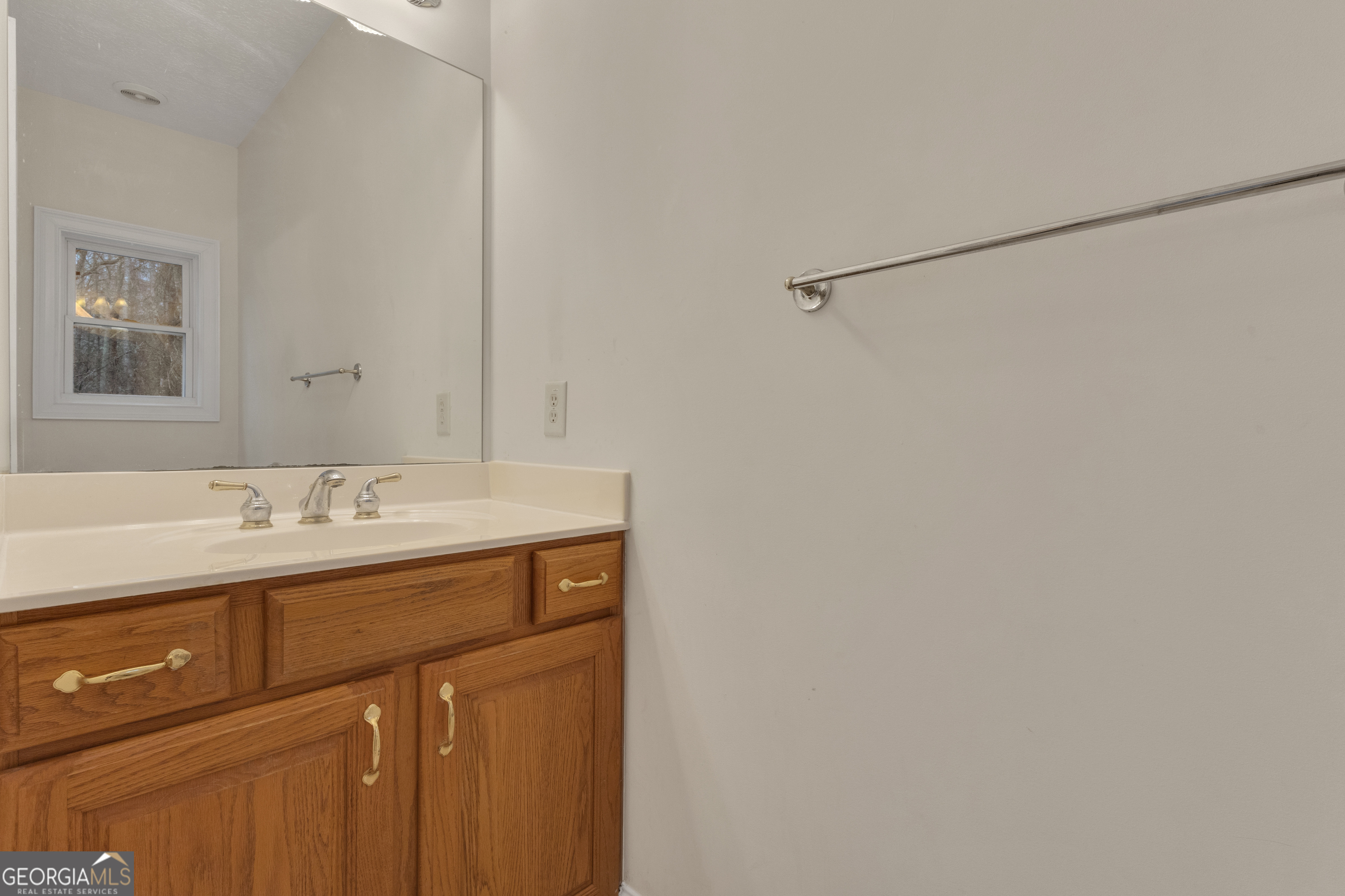 155 Rising Star Road Fayetteville, GA 30215 - Photo 39 of 89 a bathroom with a sink and a mirror