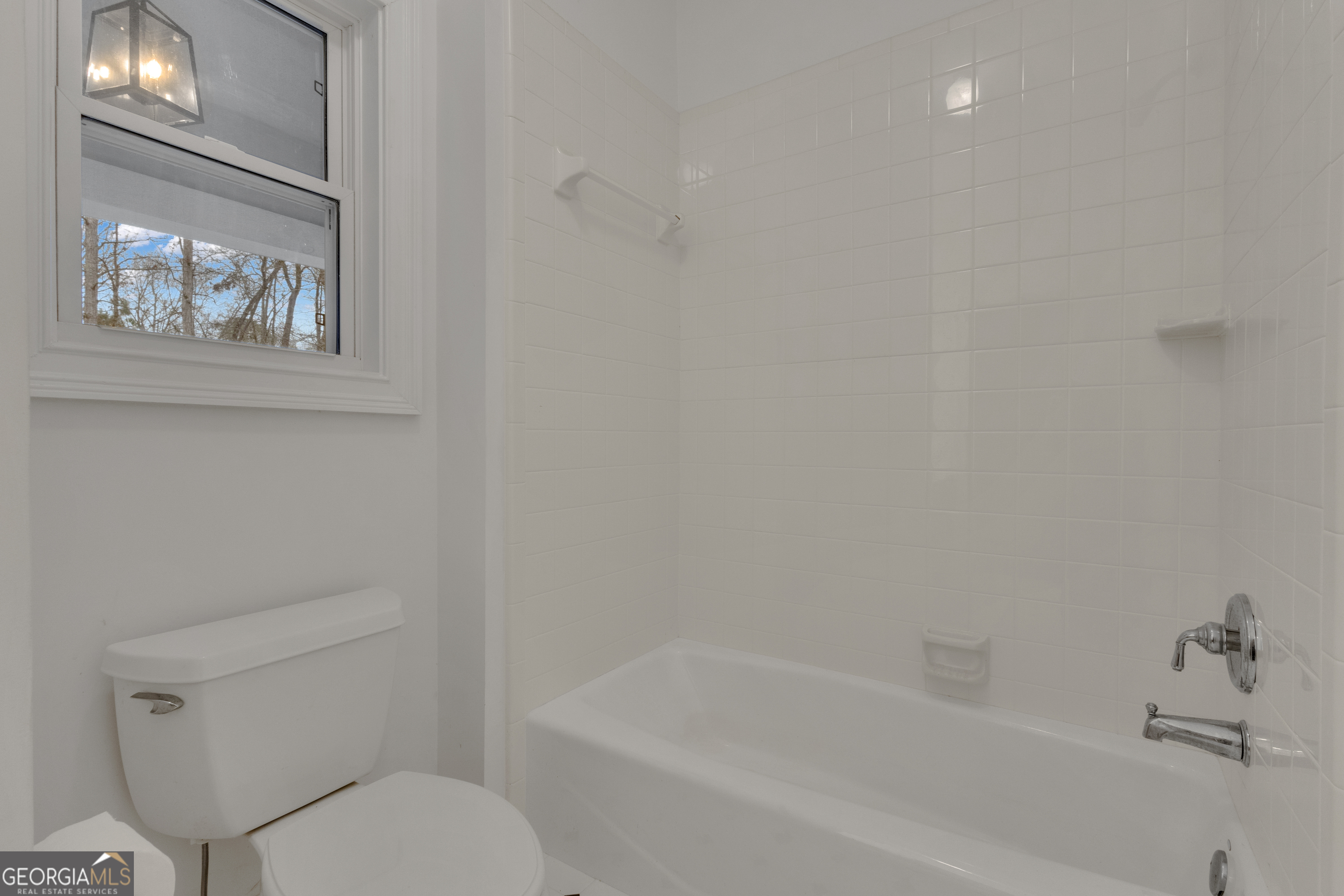 155 Rising Star Road Fayetteville, GA 30215 - Photo 45 of 89 a white toilet sitting next to a bath tub