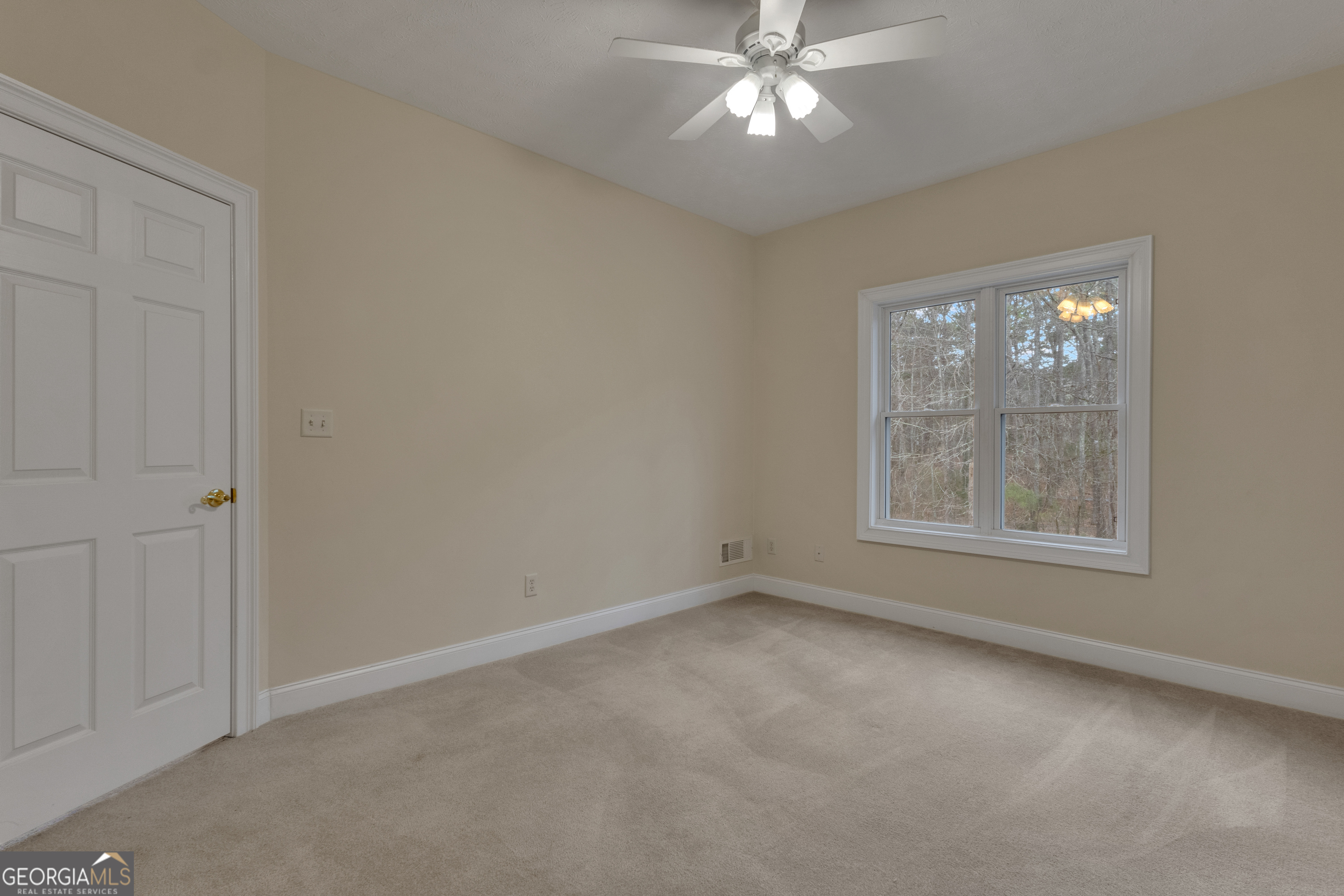 155 Rising Star Road Fayetteville, GA 30215 - Photo 47 of 89 an empty room with a window