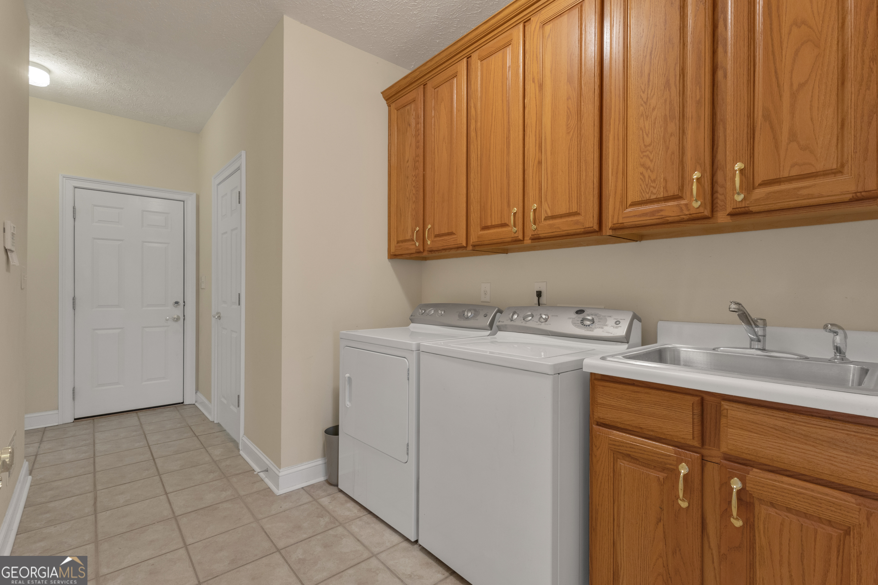 155 Rising Star Road Fayetteville, GA 30215 - Photo 48 of 89 a utility room with a sink washer and dryer
