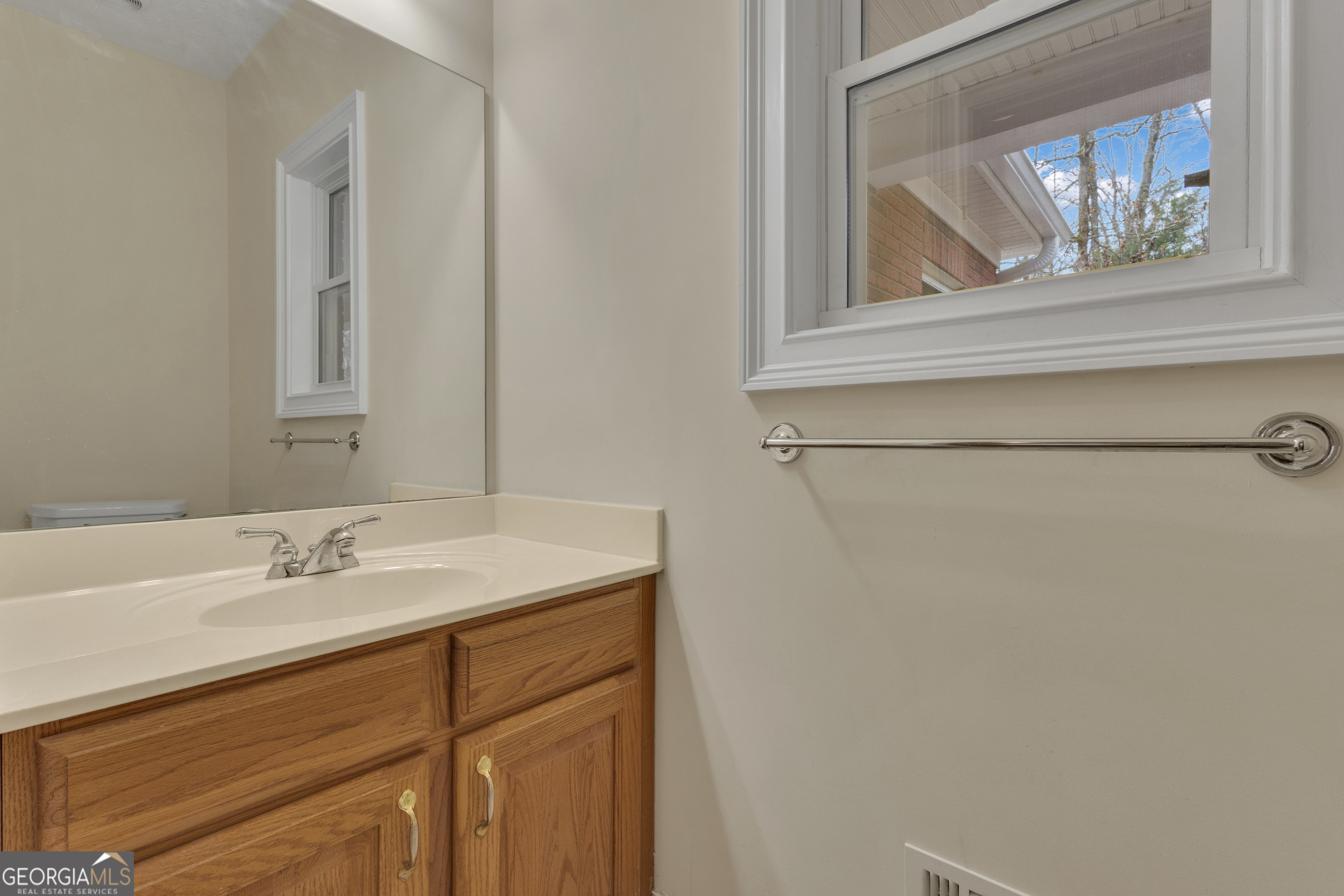 155 Rising Star Road Fayetteville, GA 30215 - Photo 49 of 89 a bathroom with a sink and a mirror