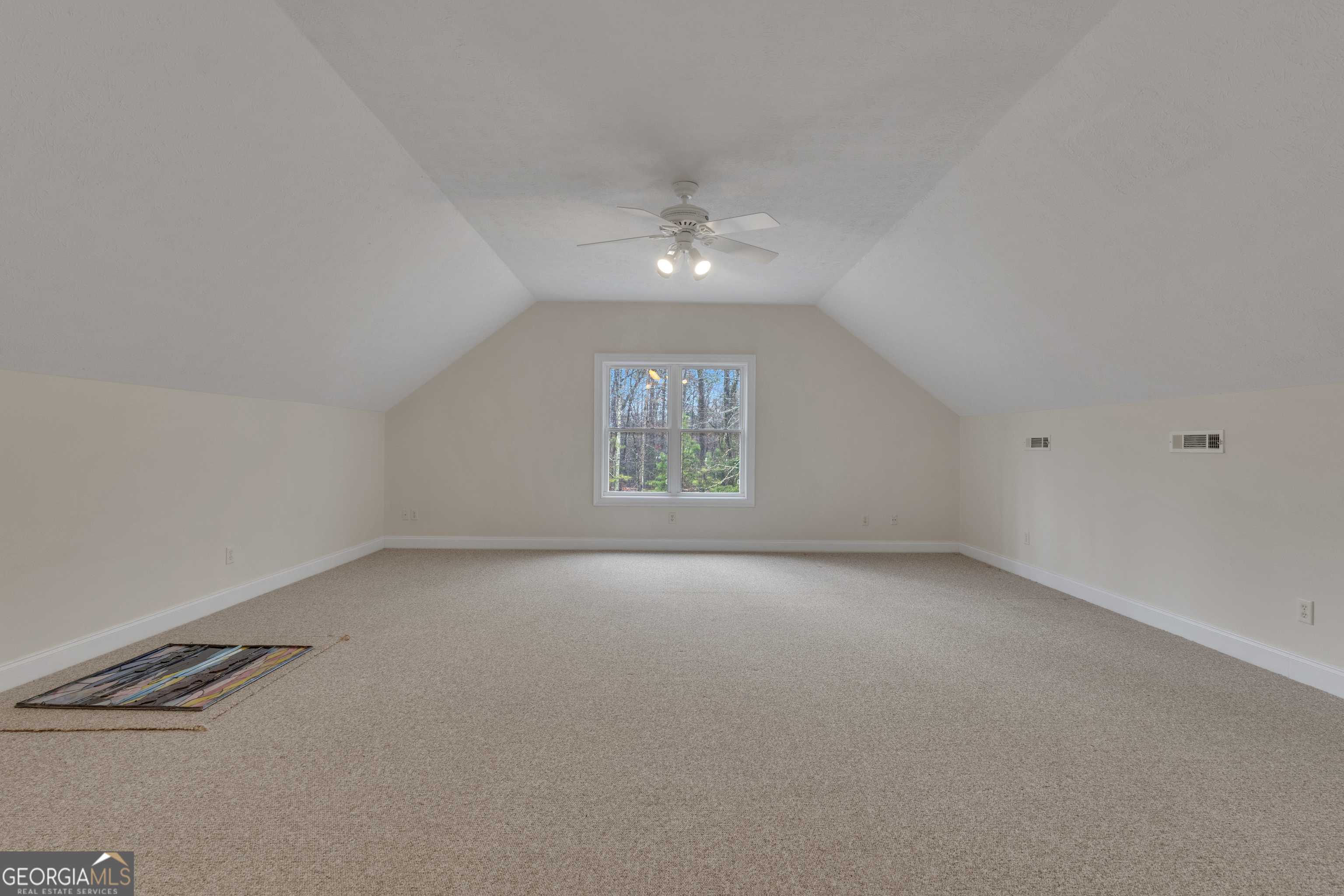 155 Rising Star Road Fayetteville, GA 30215 - Photo 51 of 89 an empty room with a window and ceiling fan