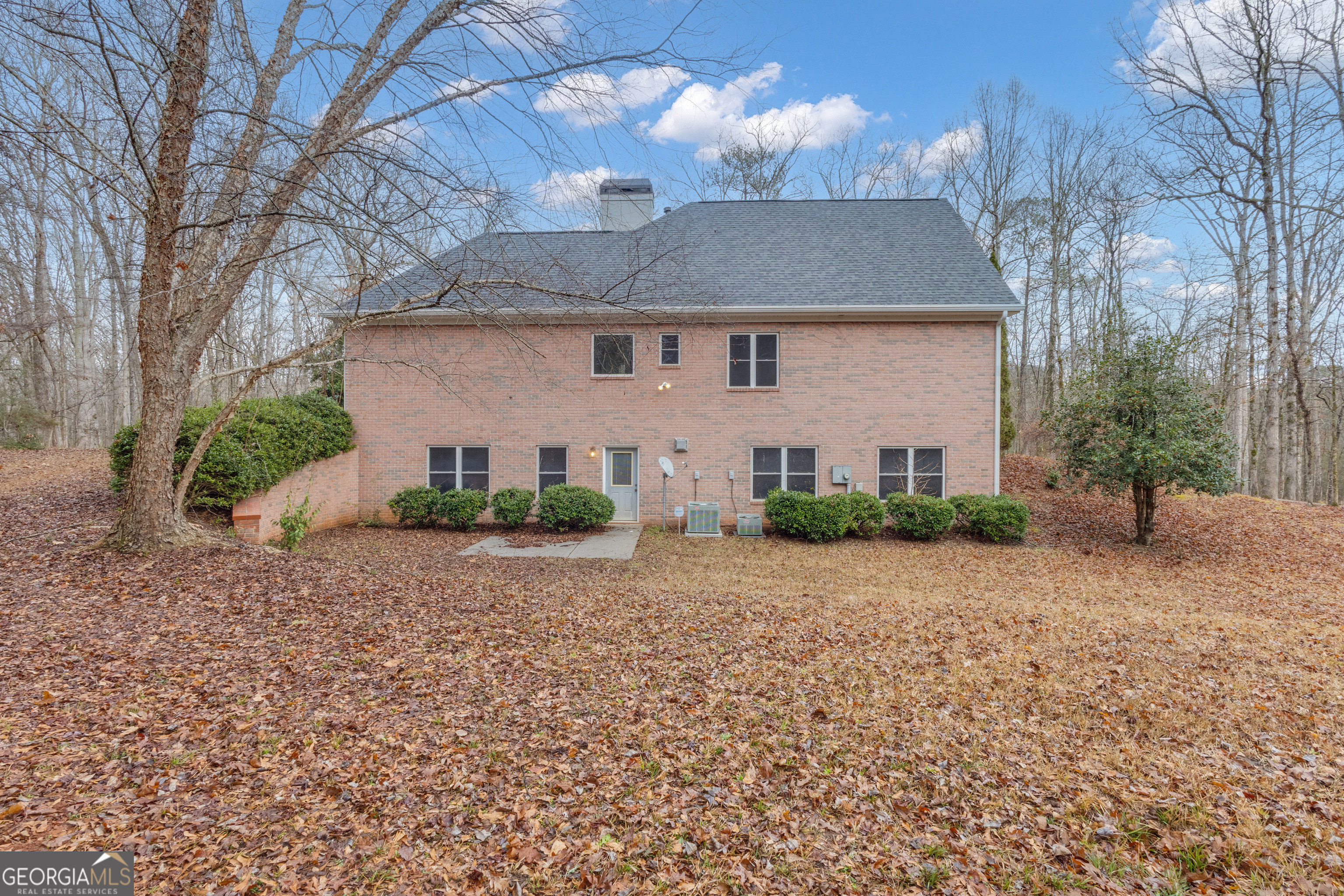 155 Rising Star Road Fayetteville, GA 30215 - Photo 75 of 89 a front view of a house with a yard and garage
