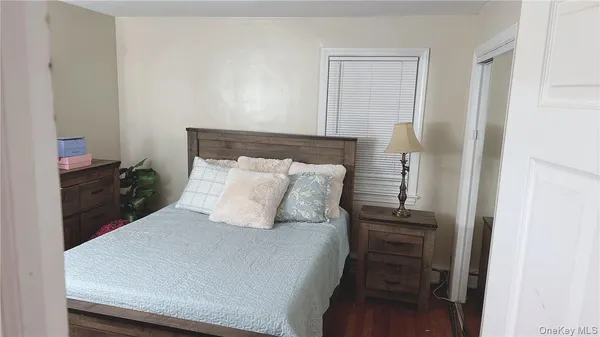 a bedroom with a bed and a cabinets