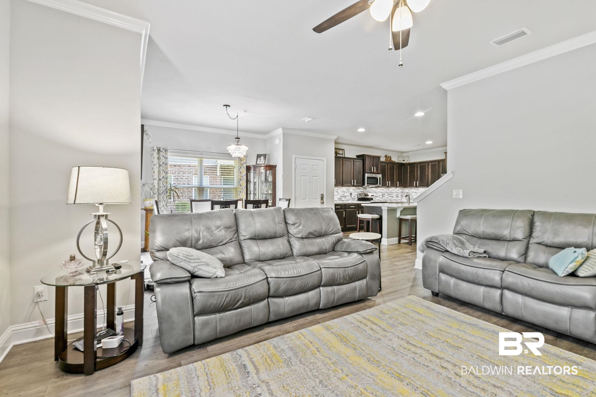 6867 Spaniel Drive, Unit B Daphne, AL 36527 - Photo 8 of 36 Living room with ceiling fan, light hardwood / wood-style flooring, and ornamental molding