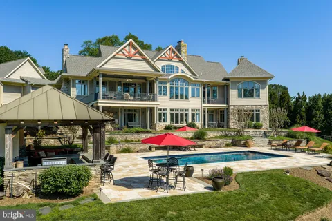 a outdoor living space with patio furniture and a fireplace