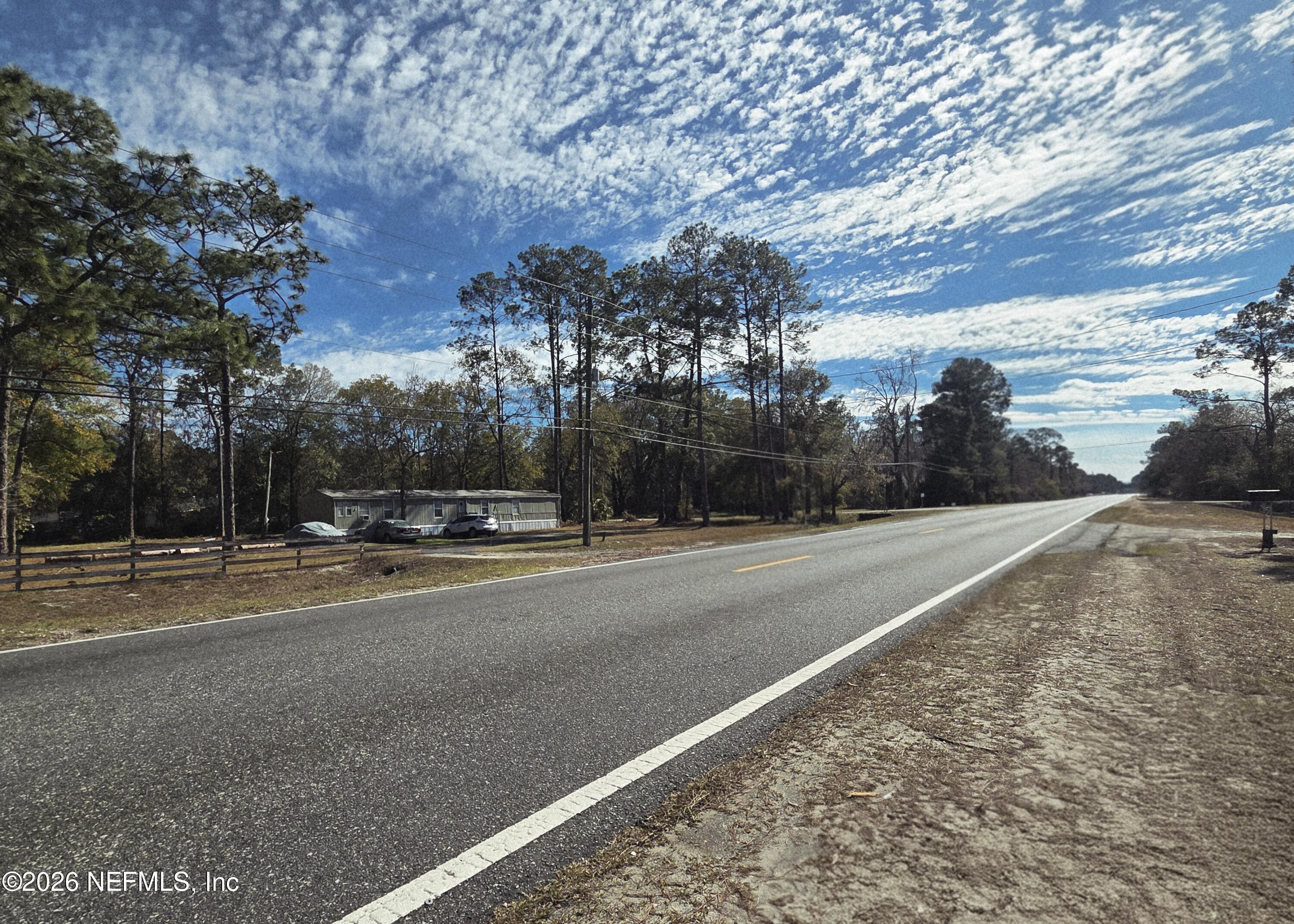 2487 Chaffee Road South Jacksonville, FL 32221 - Photo 2 of 11 a view of a road with a yard