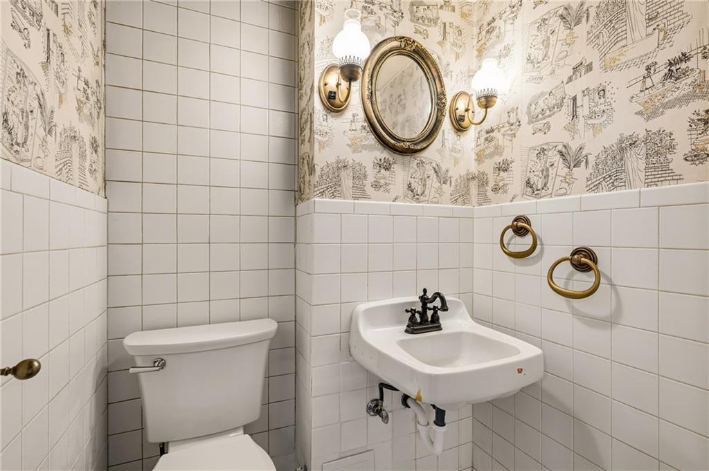 218 Elmore Road Pittsburgh, PA 15221 - Photo 21 of 34 Basement half bath with fun retro wall paper