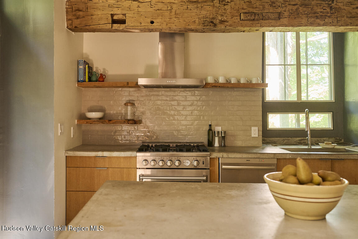 1883 Highway 213 Rifton, NY 12471 - Photo 11 of 46 a living room with stainless steel appliances kitchen island granite countertop a stove and a large window