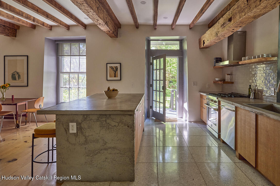 1883 Highway 213 Rifton, NY 12471 - Photo 16 of 46 a kitchen with stainless steel appliances granite countertop a stove a sink dishwasher and cabinets