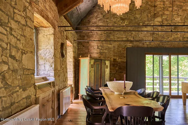 a view of a dining room with furniture and windows