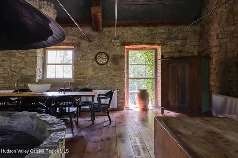 a view of a dining room with furniture and window