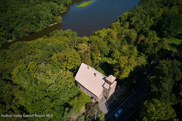 an aerial view of a house with a yard
