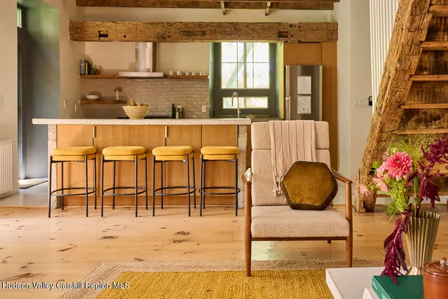 a living room filled with furniture and wooden floor