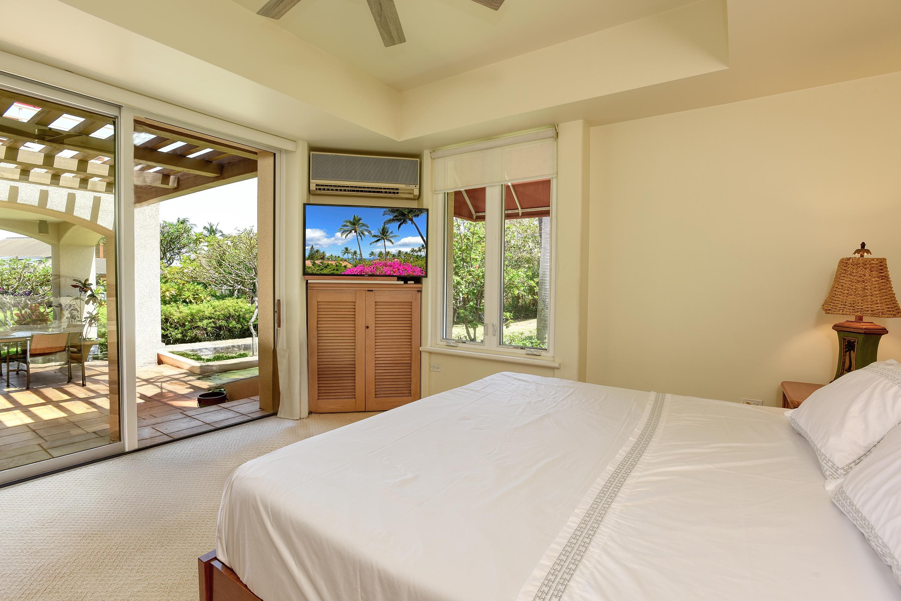 3150 Wailea Alanui Drive, Unit 3807 Kihei, HI 96753 - Photo 14 of 34 a bed sitting in a bedroom next to a window