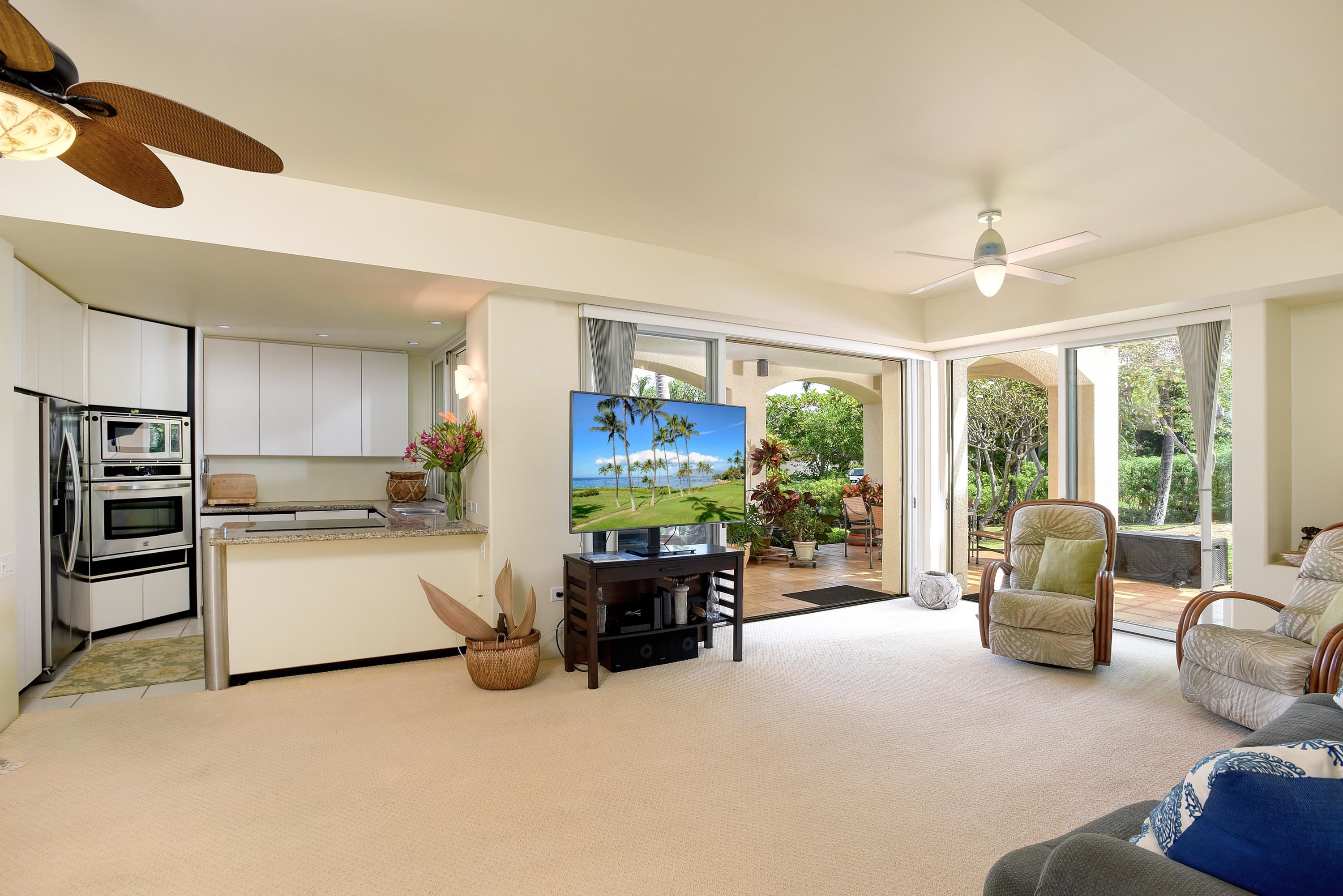 3150 Wailea Alanui Drive, Unit 3807 Kihei, HI 96753 - Photo 6 of 34 a living room with furniture and a large window