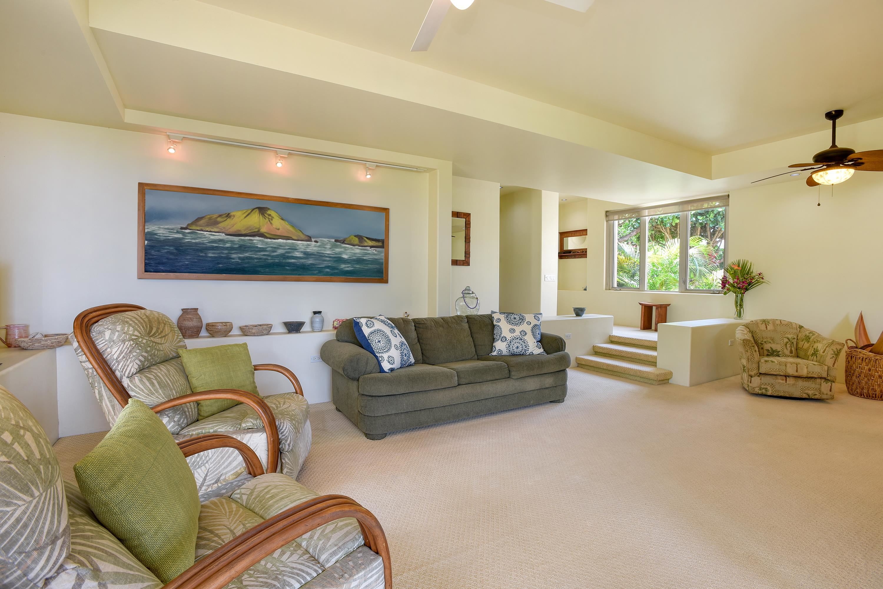 3150 Wailea Alanui Drive, Unit 3807 Kihei, HI 96753 - Photo 8 of 34 a living room with furniture and a large window