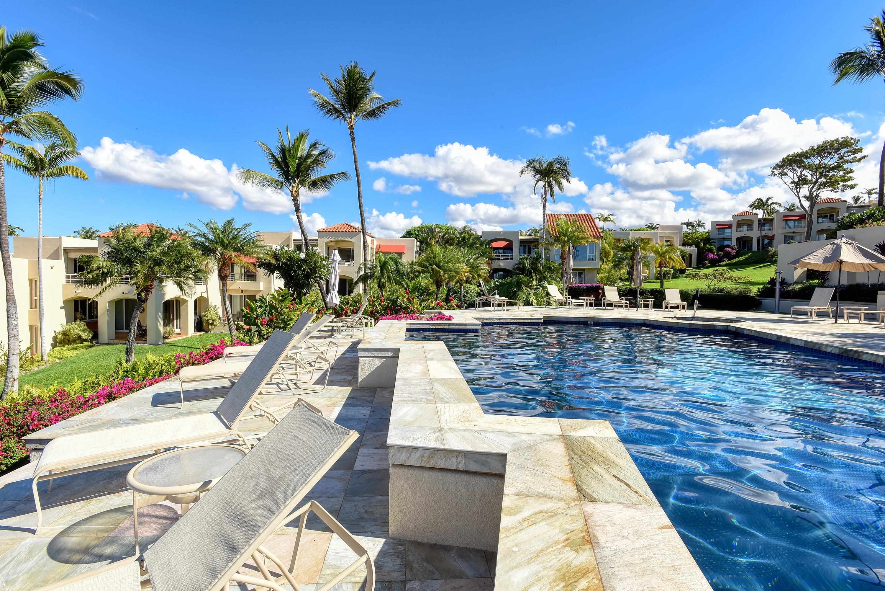 3150 Wailea Alanui Drive, Unit 3807 Kihei, HI 96753 - Photo 10 of 34 a view of a swimming pool with lounge chair