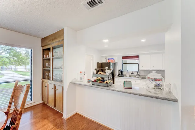 a view of living room with furniture and a window
