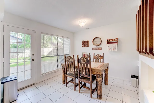 a view of a room with furniture and windows