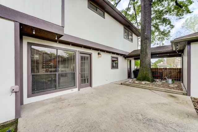 a view of a house with porch and furniture