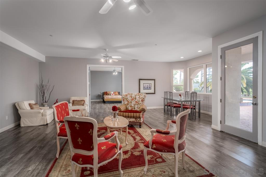 7302 Vista Rancho Court Rancho Santa Fe, CA 92091 - Photo 13 of 22 a view of a dining room with furniture and wooden floor