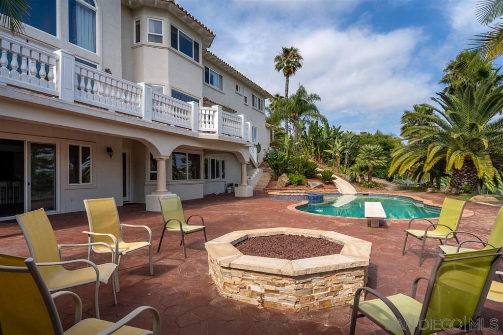 7302 Vista Rancho Court Rancho Santa Fe, CA 92091 - Photo 16 of 22 a view of a chairs and table in backyard