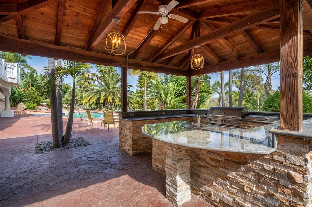 7302 Vista Rancho Court Rancho Santa Fe, CA 92091 - Photo 18 of 22 a view of a swimming pool with a patio