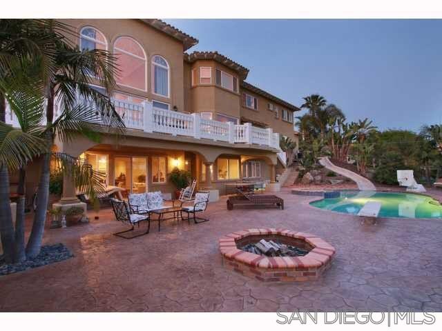 7302 Vista Rancho Court Rancho Santa Fe, CA 92091 - Photo 20 of 22 a view of a chairs and a table in the patio