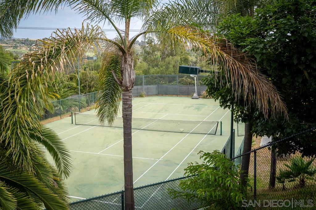 7302 Vista Rancho Court Rancho Santa Fe, CA 92091 - Photo 21 of 22 a view of a yard with plants and wooden fence