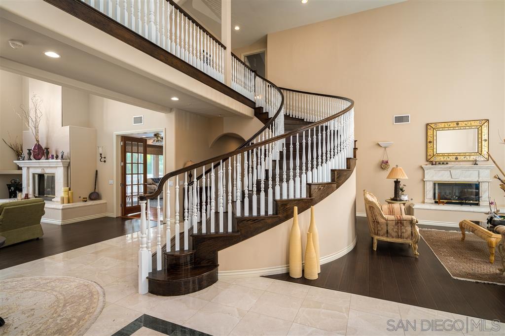 7302 Vista Rancho Court Rancho Santa Fe, CA 92091 - Photo 4 of 22 a view of entryway and hall with wooden floor
